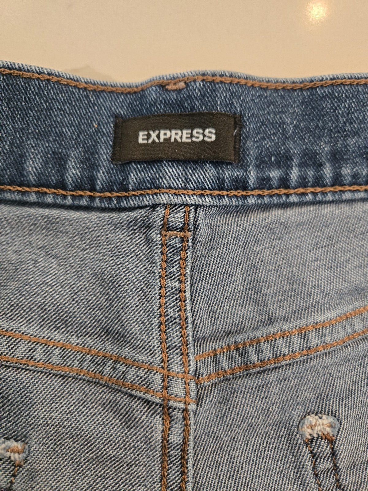 EXPRESS Size 12 Distressed Denim Shorts Womens Frayed Raw Hem Blue Jean