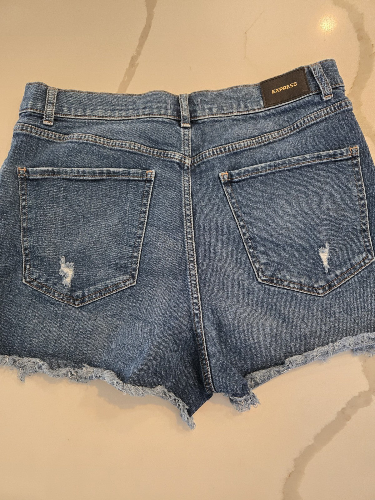 EXPRESS Size 12 Distressed Denim Shorts Womens Frayed Raw Hem Blue Jean
