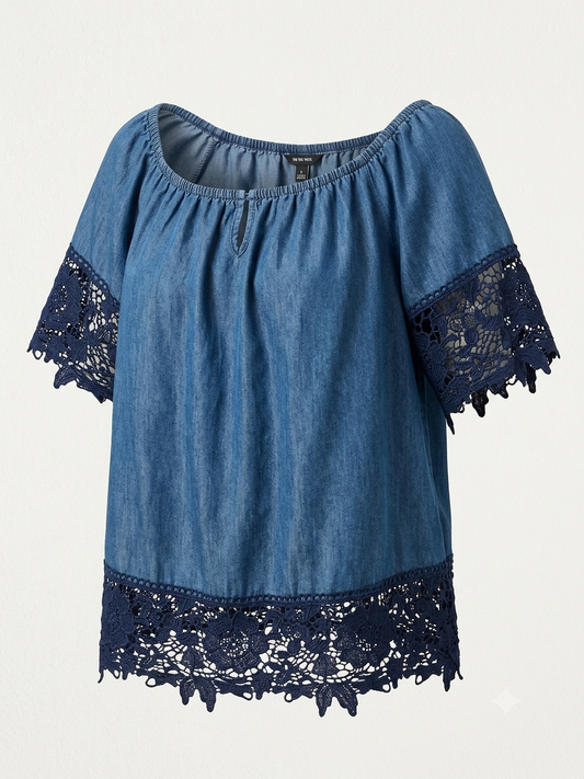 Alt Text: Unique Spectrum medium wash denim boho blouse with floral navy lace sleeves and hem
